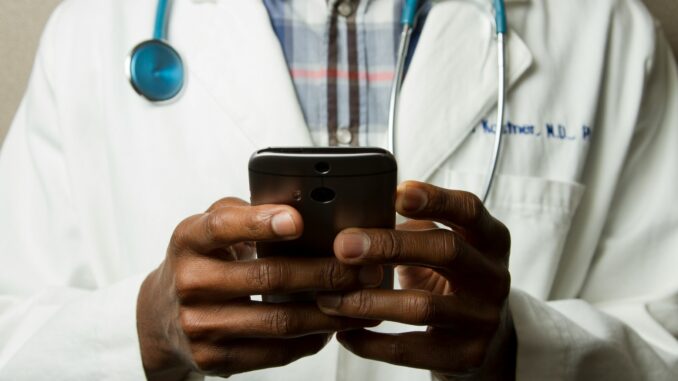 MHRA pilots ‘AI Airlock’ to accelerate healthcare adoption Doctor on a smartphone illustrating the AI Airlock scheme from the Medicines and Healthcare products Regulatory Agency (MHRA) in the UK that aims to accelerate the adoption of artificial intelligence technologies into the NHS healthcare system with a high emphasis on safety.